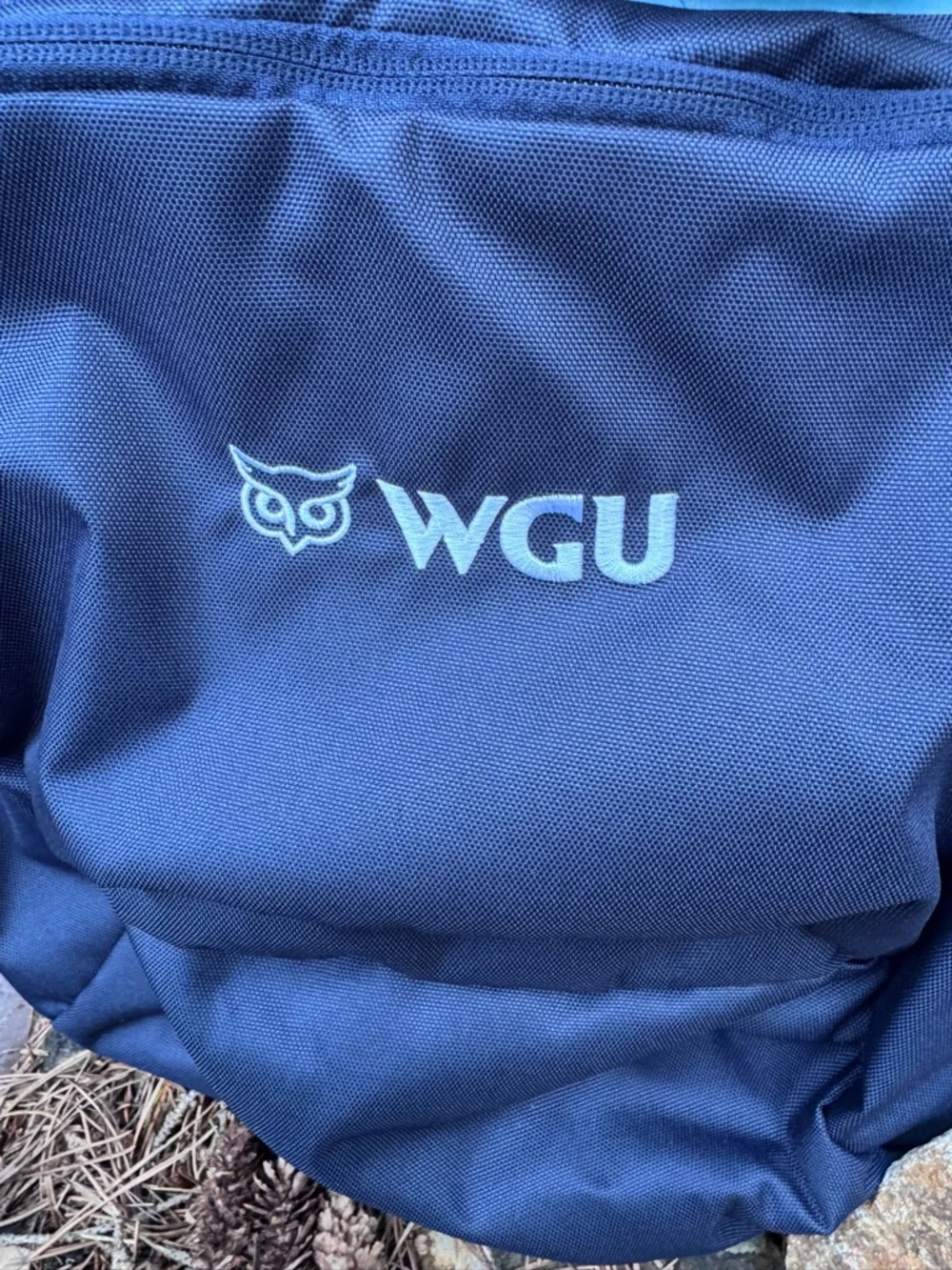 cotopaxi WGU Navy Backpack with Light Blue Accents and Orange Zippers